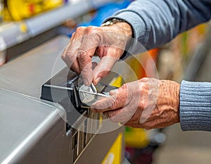 Hands Using Card Payment Terminal at Checkout