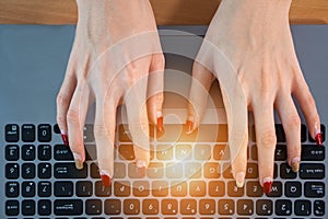 Hands using computer keyboard