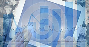 Hands using digital tablet with graph overlay