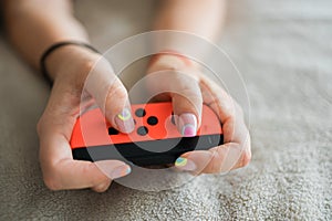Hands using game controller. Playing video games