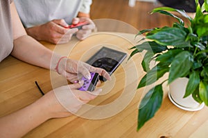 Hands using game controller. Playing video games