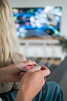 Hands using game controller. Playing video games