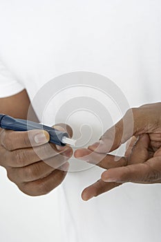 Hands Using Lancing Device