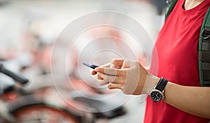 Hands using smartphone scanning the QR code