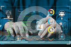 hands using typing keyboard with creative binary coding hologram on blurry background. Software programming code. Technology,