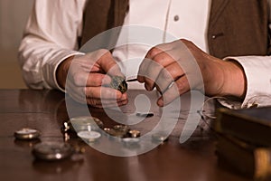 Hands of a Victorian watchmaker