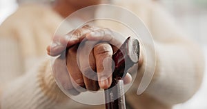 Hands, walking stick and elderly person in home for retirement support, healthcare and help. Closeup, lonely senior