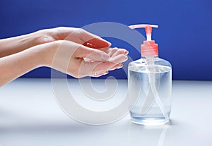 Hands washing and desinfection,woman`s hands and soap bottle.Coronavirus protection