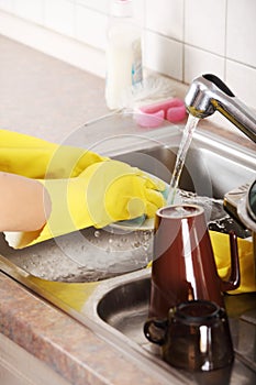 Hands washing dish