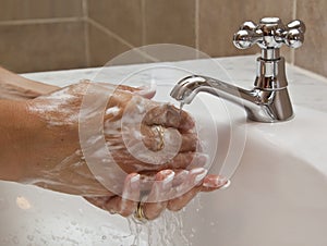 Hands washing under running water