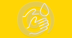 Hands and water drop on yellow background. Precautions cleanliness hygiene coronavirus pandemic