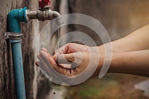 Hands of water from faucets photo