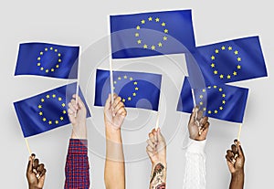 Hands waving flags of the EuropeanUnion