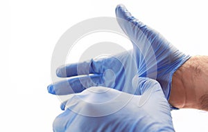 Hands wearing blue medical latex gloves Protection against flu, virus and coronavirus. Health care and surgical concept. Correct