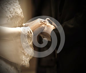 Hands in wedding ceremony