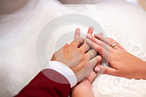 hands, wedding rings and marriage vows