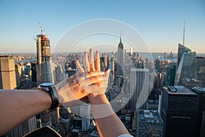 Hands with weeding rings with the Empire State in the background