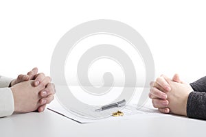 Hands of wife, husband signing decree of divorce, dissolution, canceling marriage, legal separation documents, filing