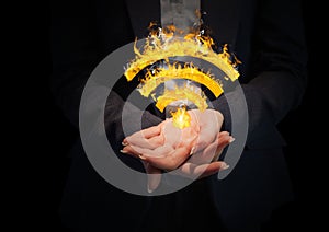 hands with WIFI fire icon between. Black background