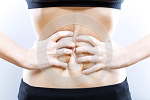 Hands of woman with belly, weight loss concept