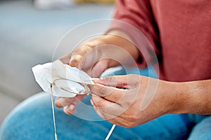 Hands, woman and cleaning dust of glasses with fabric tissue for protection, sight and eyes. Girl, microfiber cloth and