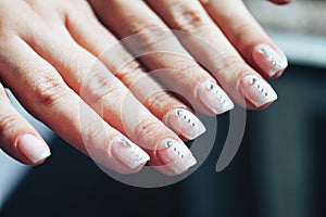 Hands of a Woman with Decorated Nails