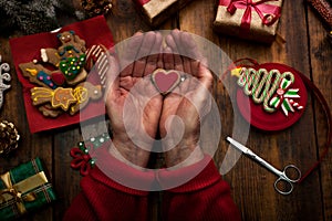 Hands of woman decorating Christmas gifts and decorations