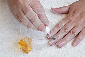 Lubricating the cuticles with conditioner photo
