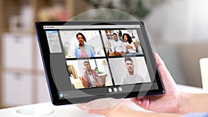 Hands of woman having video chat on tablet pc