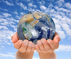 Hands of woman holding globe, Africa and Near East