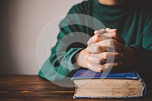 Hands woman laying on the biblical while praying for christian religion blessings and Pray to God