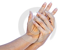 Hands of a woman with long nails without paint or touch-ups