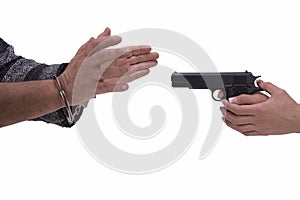 Hands of woman and man with gun and handcuffs