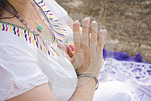 Hands of woman meditating