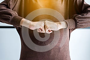 Hands of woman show strength teamwork,Fist bump and putting her hand for successful