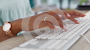 Hands of a woman typing an email on a keyboard as feedback for an advertising, marketing and corporate company. Contact