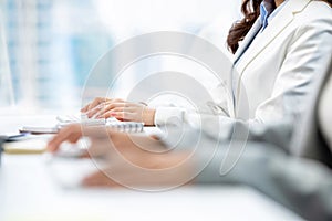 Hands of woman white collar workers typing on computer keyboards