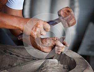 Hands woodcarver with the tools