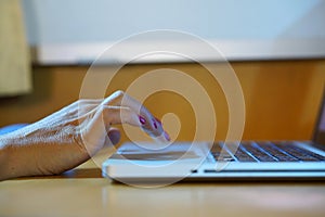 Hands working on the computer keyboard