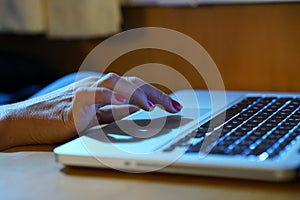 Hands working on the computer keyboard