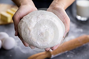 Hands working with dough preparation recipe bread, pizza or pie making ingridients