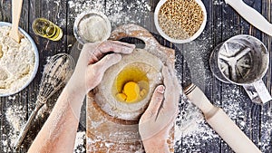 Hands working with dough preparation recipe bread, pizza or pie making ingridients, food flat lay on kitchen table background