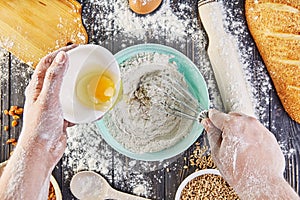 Hands working with dough preparation recipe bread, pizza or pie making ingridients, food flat lay on kitchen table background