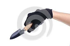 Hands in working gloves holding gardening tool shovel