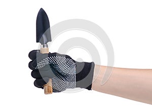 Hands in working gloves holding gardening tool shovel