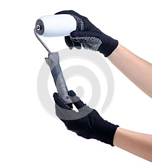 Hands in working gloves holding paint roller build