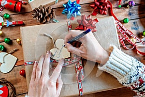 Hands wrapping Christmas gifts