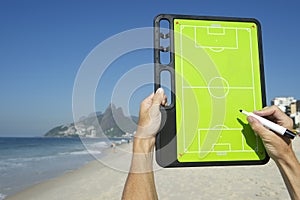 Hands Writing on Football Tactics Board Rio Beach Brazil