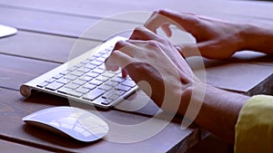 Hands are writing on a keyboard