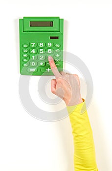 Hands in yellow jacket and green calculator